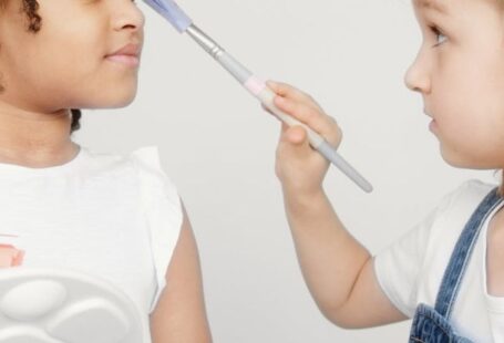 Innovative Fashion - Two Kids Holding a Paintbrush and a Palette