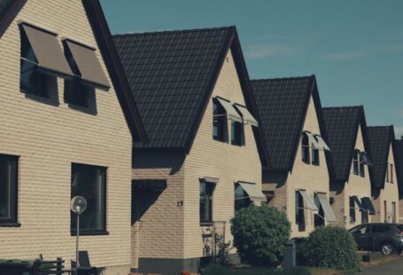 Neighborhoods - A row of houses with windows and a roof